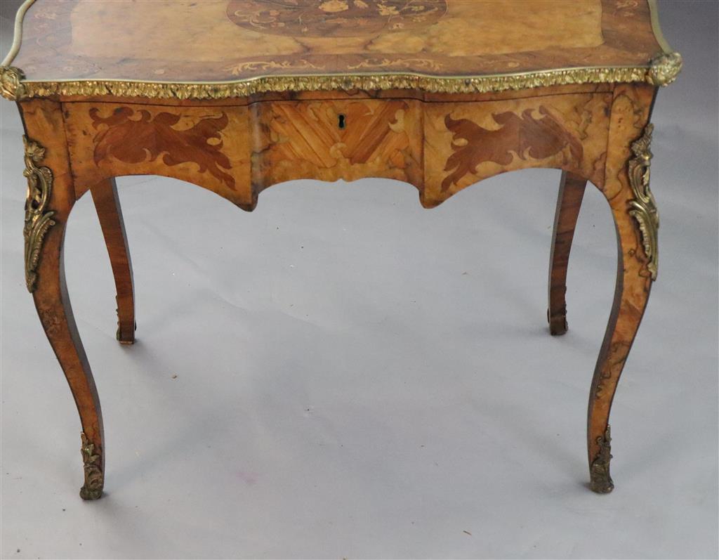 A late 19th century French ormolu mounted walnut, rosewood and marquetry writing table, W.3ft 1in. D.1ft 9in. H.2ft 6in.